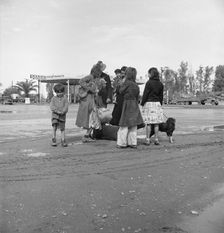 Family of homeless, walking people are left at the edge of the next town, 1939. Creator: Dorothea Lange