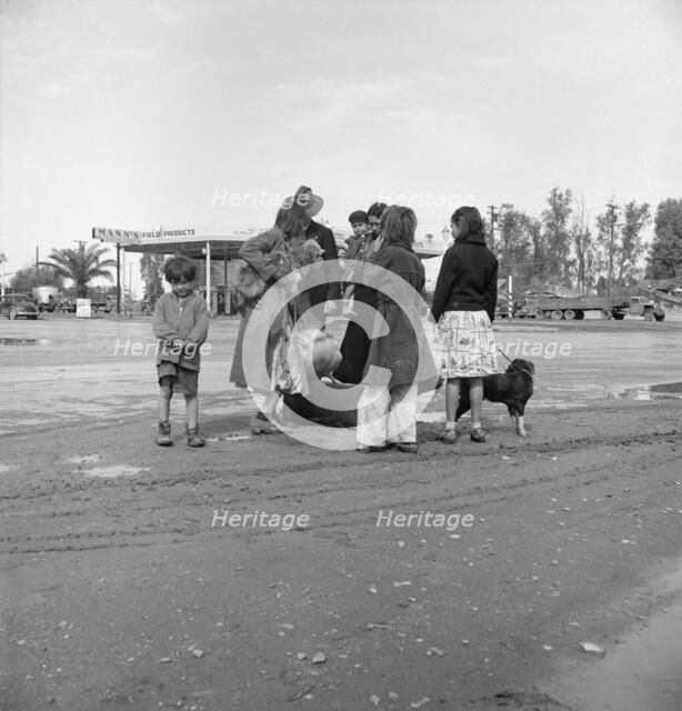 Family of homeless, walking people are left at the edge of the next town, 1939. Creator: Dorothea Lange.