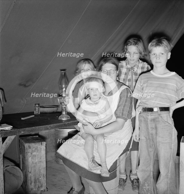 Family of six in tent after supper, FSA mobile unit, Merrill, Klamath County, Oregon, 1939 Creator: Dorothea Lange.