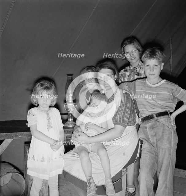 Family of six in tent after supper, FSA mobile unit, Merrill, Klamath County, Oregon, 1939 Creator: Dorothea Lange.