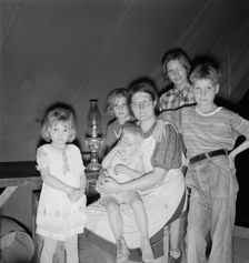 Family of six in tent after supper, FSA mobile unit, Merrill, Klamath County, Oregon, 1939 Creator: Dorothea Lange