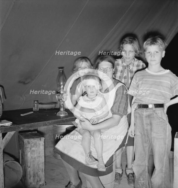Family of six in tent after supper, FSA mobile unit, Merrill, Klamath County, Oregon, 1939 Creator: Dorothea Lange.