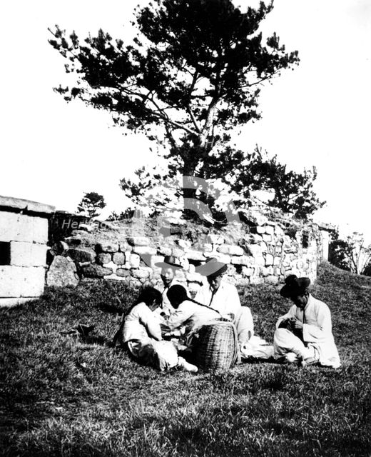 Family enjoying a picnic, Korea, 1900. Artist: Unknown