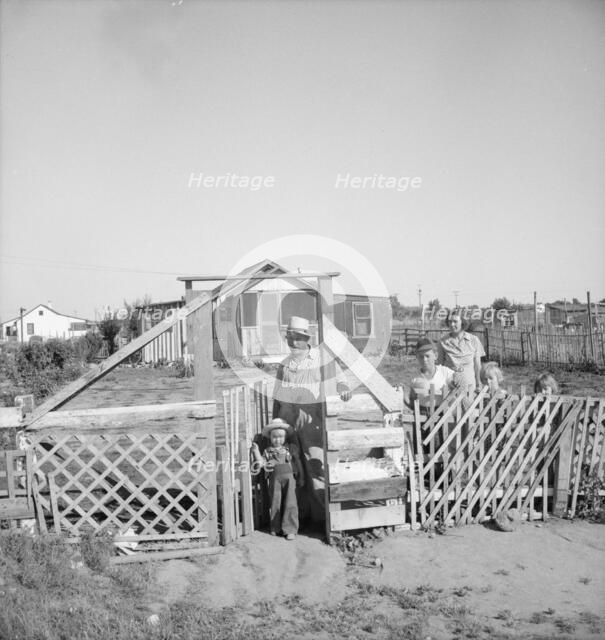 Family from Oklahoma, Highway City, near Fresno, California, 1939. Creator: Dorothea Lange.