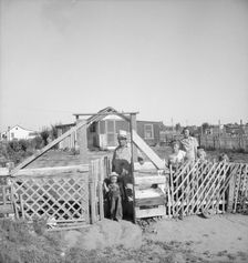Family from Oklahoma, Highway City, near Fresno, California, 1939. Creator: Dorothea Lange