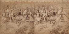 Family group posing in cotton field, c1880-c1889. Creator: Unknown