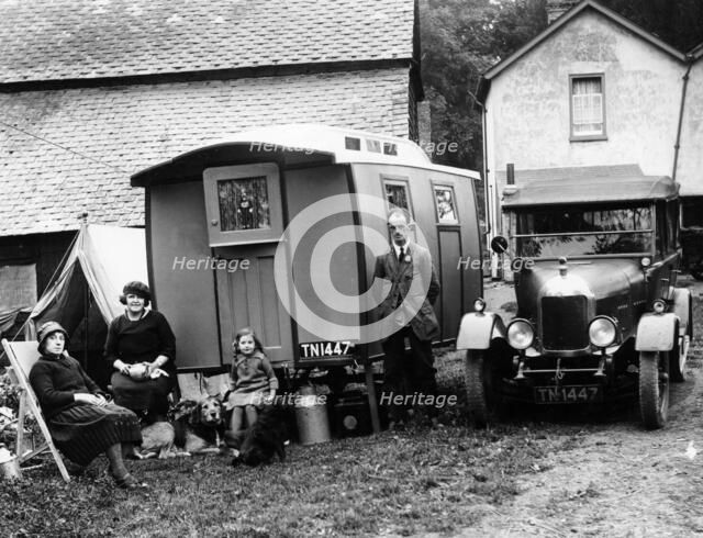 Family group with a 1925 Morris Oxford 14/28 and caravan, (Eccles, c1926?). Artist: Unknown