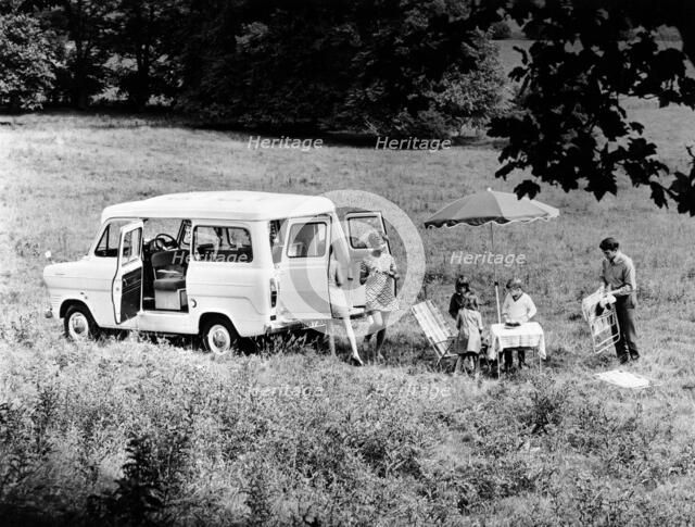 Family group with a 1968 Ford Explorer Camper van, (1968?). Artist: Unknown