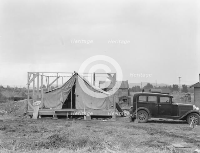 Family living in tent while building..., near Klamath Falls, Klamath county, Oregon, 1939. Creator: Dorothea Lange.