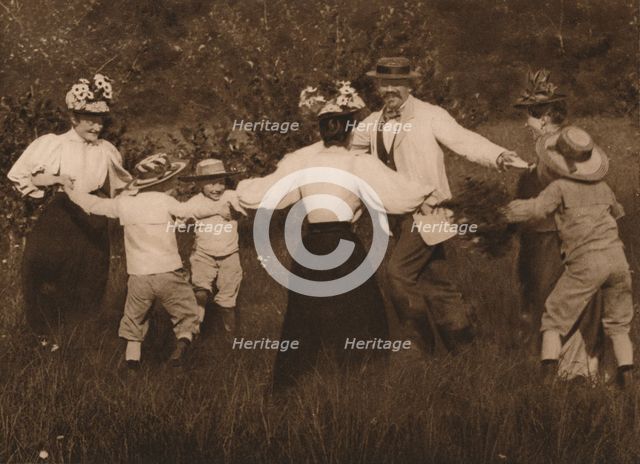 'Family playing games in a field', 1937. Artist: Unknown.