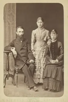 Family portrait of an unidentified man and his two daughters, 1885. Creator: Unknown