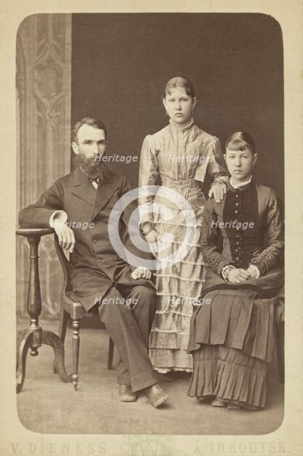 Family portrait of an unidentified man and his two daughters, 1885. Creator: Unknown.