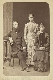 Family portrait of an unidentified man and his two daughters, 1885. Creator: Unknown
