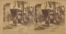 Family portrait posed on front porch of house, about 1865. Creator: Unknown