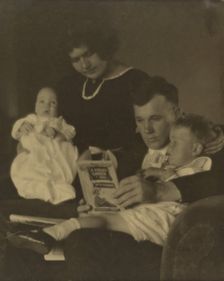 Family Portrait with A Child's Garden of Verses, about 1920. Creator: Louis Fleckenstein