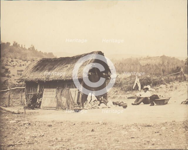 Family Seated by Thatched Hut, South America, 1850s. Creator: Unknown.