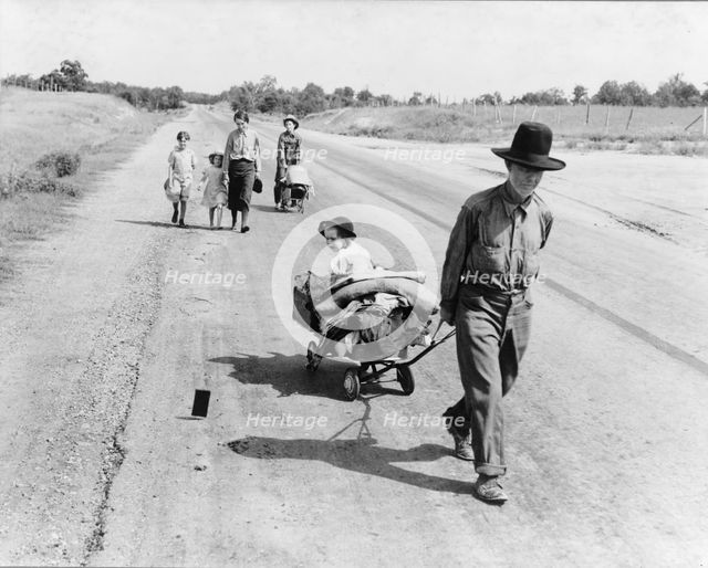 Family walking on highway, five children, Pittsburg County, Oklahoma, 1938. Creator: Dorothea Lange.