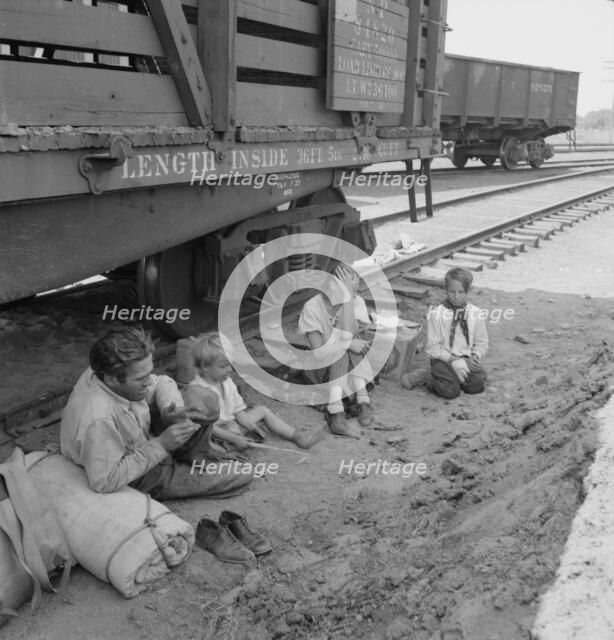 Family who traveled by freight train, Washington, Toppenish, Yakima Valley, 1939. Creator: Dorothea Lange.