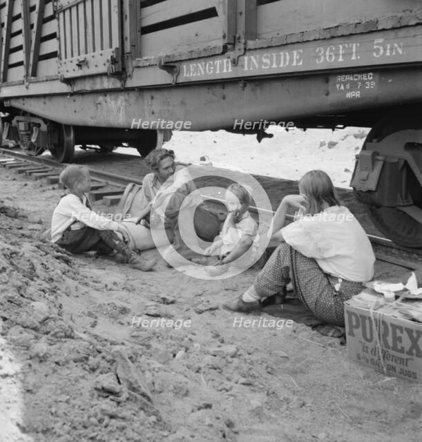 Family who traveled by freight train, Washington, Toppenish, Yakima Valley, 1939. Creator: Dorothea Lange.