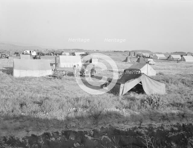 Families camped on flat before season opens waiting..., near Merrill, Klamath County, Oregon, 1939. Creator: Dorothea Lange.