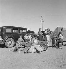 Families from the Dust Bowl in Texas in an overnight roadside camp near Calipatria, California, 1937 Creator: Dorothea Lange
