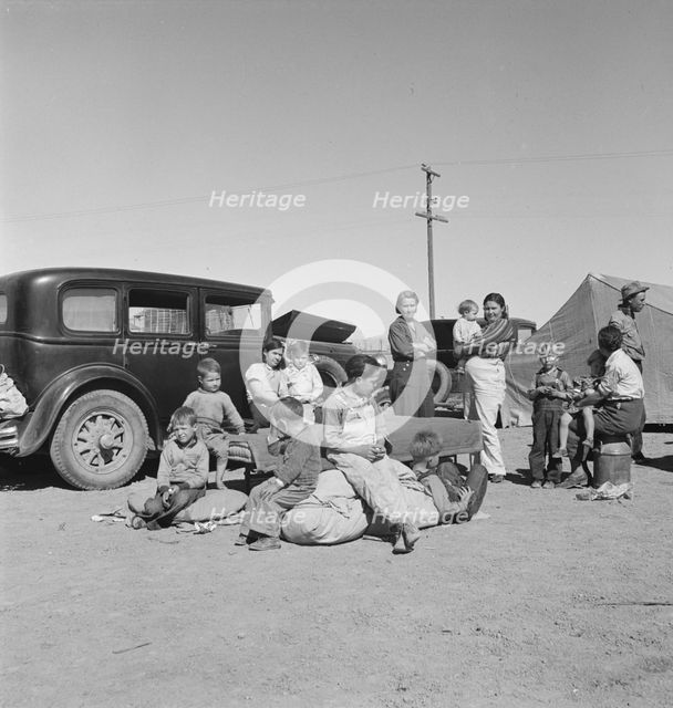 Families from the Dust Bowl in Texas in an overnight roadside camp near Calipatria, California, 1937 Creator: Dorothea Lange.