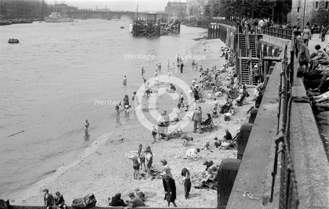 Families on Tower Beach, London, c1945-c1955. Artist: SW Rawlings