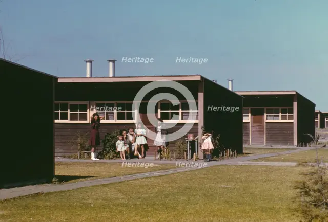 Families of migratory workers in front of their row shelters, FSA ...camp, Robstown, Tex., 1942. Creator: Arthur Rothstein.