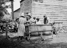 Families stringing tobacco brought in..., Granville County, North Carolina, 1939. Creator: Dorothea Lange