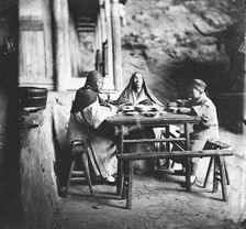 Fangguangyan monastery, Fujian province, China: three monks at the meal table, 1870-18711. Creator: John Thomson