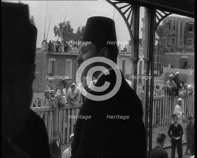 Farouk I, His Majesty The King of Egypt Waving to Crowds, 1936. Creator: British Pathe Ltd.