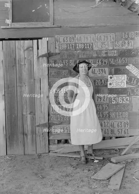 Farm woman beside her barn door,  Tulare County, California, 1938. Creator: Dorothea Lange.