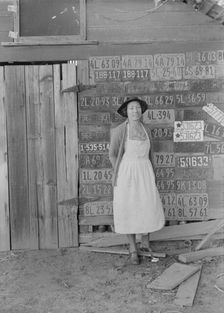 Farm woman beside her barn door, Tulare County, California, 1938. Creator: Dorothea Lange