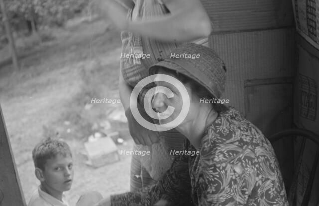 Farm woman in conversation with relief investigator, West Virginia, 1935. Creator: Walker Evans.
