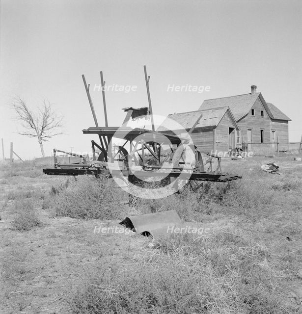 Farm machinery left on abandoned dry land farm in Columbia Basin, Grant County, Washington, 1939. Creator: Dorothea Lange.