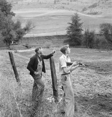 Farmer and boy in the fall of the year at the time the hunting..., Jackson County, Oregon, 1939. Creator: Dorothea Lange