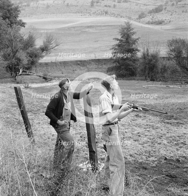 Farmer and boy in the fall of the year at the time the hunting..., Jackson County, Oregon, 1939. Creator: Dorothea Lange.