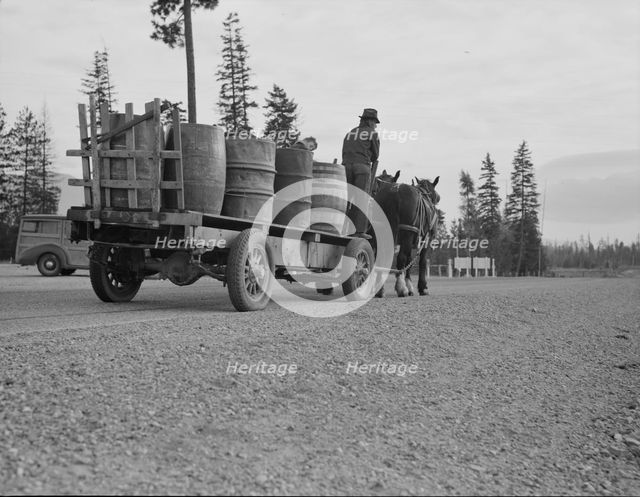 Farmer and his boy hauling water for drinking and domestic purposes..., Boundary County, Idaho, 1939 Creator: Dorothea Lange.