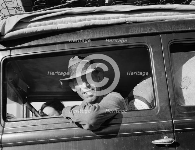 Farmer from Independence, Kansas, on the road at cotton chipping time, U.S. 99, California, 1939. Creator: Dorothea Lange.