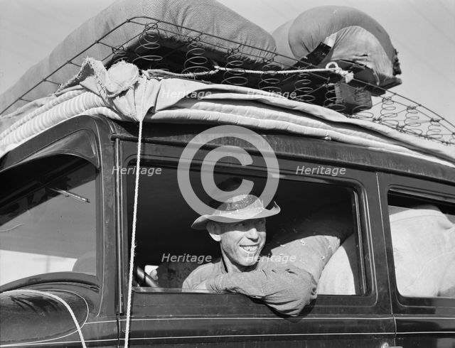 Farmer from Independence, Kansas, on the road at cotton chipping time, U.S. 99, California, 1939. Creator: Dorothea Lange.