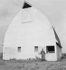 Farmer from Nebraska and his new barn on the Yamhill farms..., Yamhill County, Oregon, 1939. Creator: Dorothea Lange
