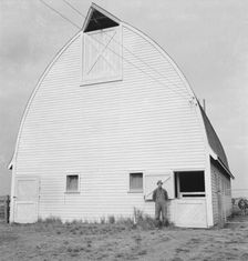 Farmer from Nebraska and his new barn on the Yamhill farms..., Yamhill County, Oregon, 1939. Creator: Dorothea Lange