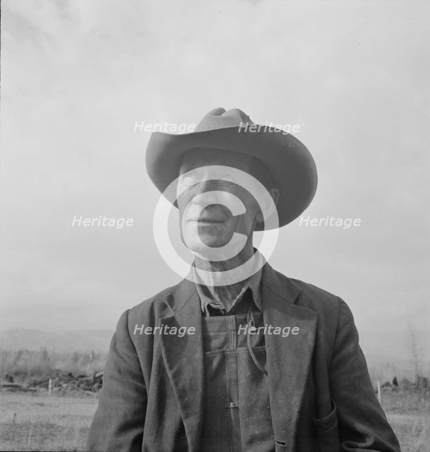 Farmer from Nebraska now developing eighty-acre stump farm, Bonner County, Idaho, 1939. Creator: Dorothea Lange.