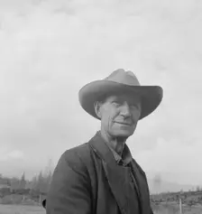Farmer from Nebraska now developing eighty-acre stump farm, Bonner County, Idaho, 1939. Creator: Dorothea Lange