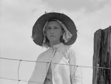 Farmer's daughter in the fields, farm in Georgia, 1937. Creator: Dorothea Lange