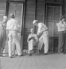 Farmers at tobacco auction, Douglas, Georgia, 1938. Creator: Dorothea Lange