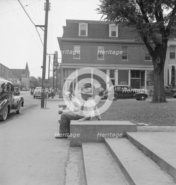 Farmers idling around the courthouse, Roxboro, North Carolina, 1939. Creator: Dorothea Lange.