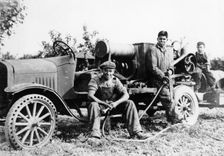 Farmworkers with a tractor, (c1930s?)