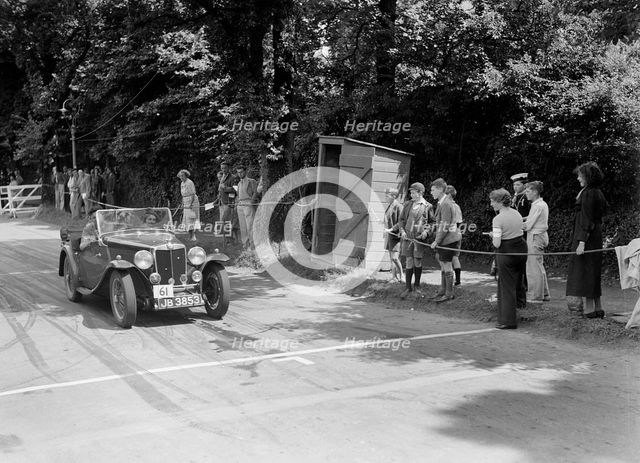 FE Ainley's MG Magnette NA, winner of a bronze award at the MCC Torquay Rally, July 1937. Artist: Bill Brunell.