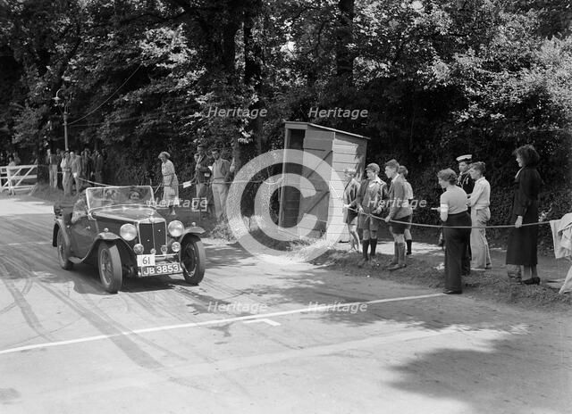 FE Ainley's MG Magnette NA, winner of a bronze award at the MCC Torquay Rally, July 1937. Artist: Bill Brunell.